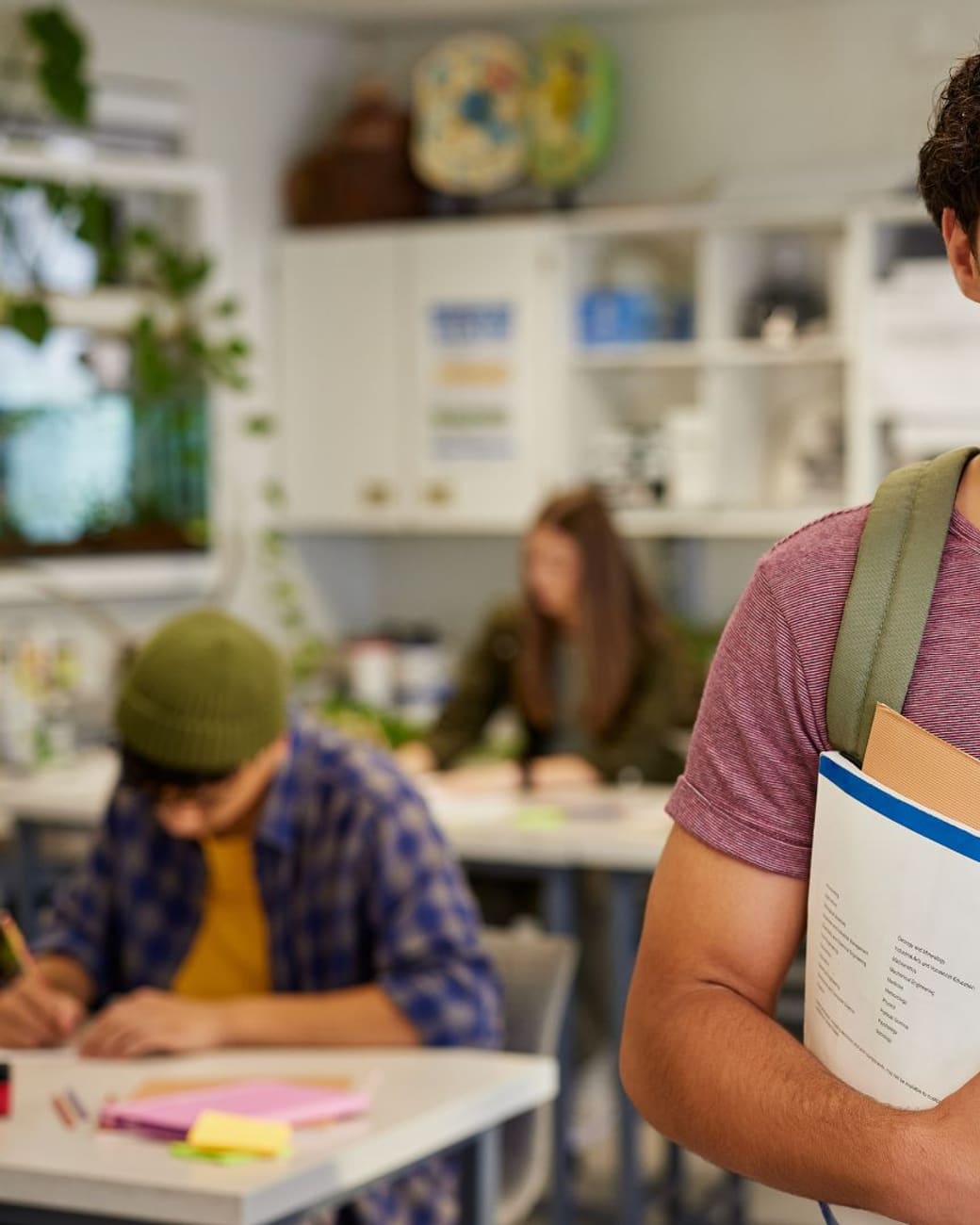 Confident student ready for class with books in hand