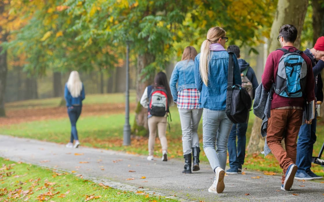Students walking a tree-lined path near Bemus Point, NY