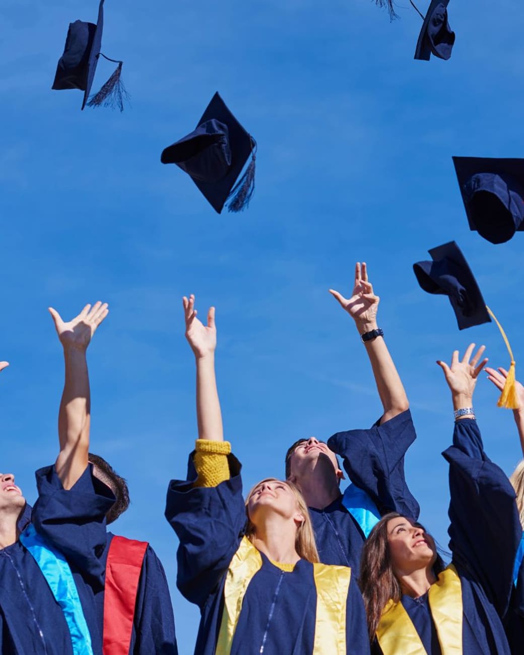 Graduates throwing caps in the air — the goal beyond the score