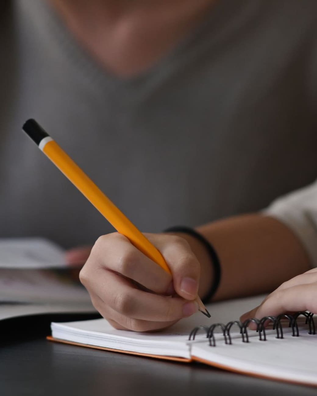 Tutor helping a focused student mark up a practice problem