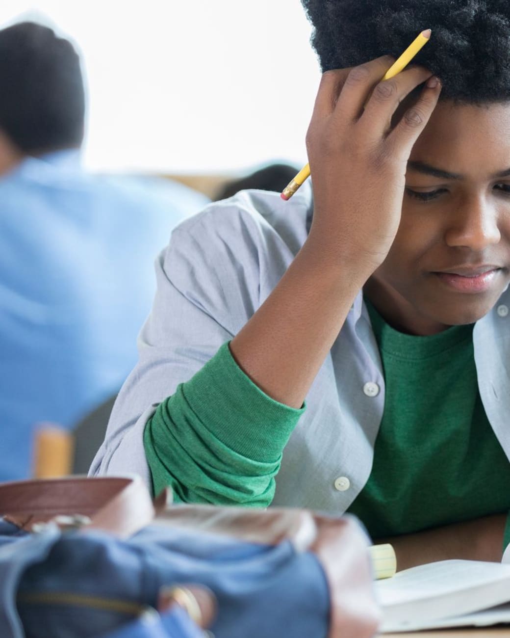 Student deep in concentration over a practice test